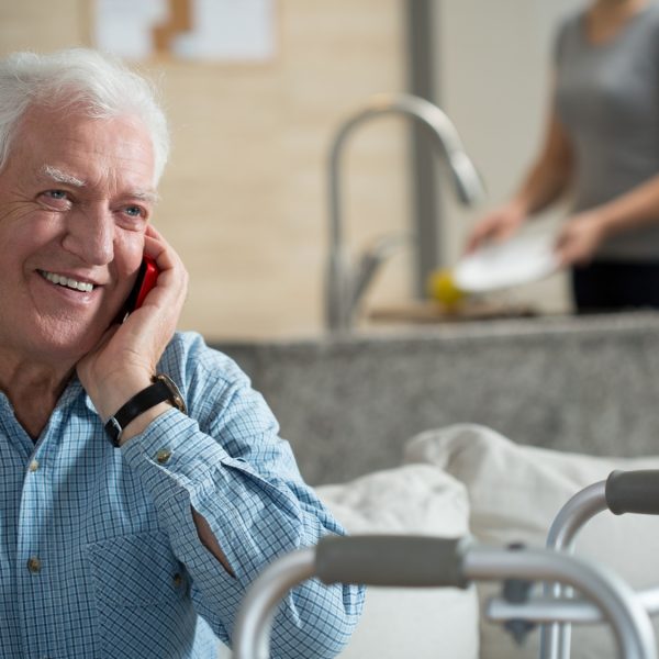 Elderly sick man talking the mobile phone